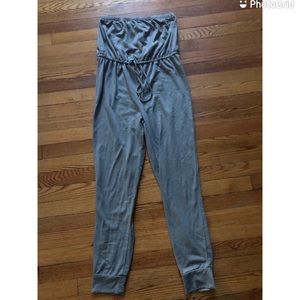 Green Romper in size medium, good condition with adjustable tie around waist